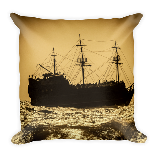 Square pillow with gold background and pirate galleon ship in the foreground